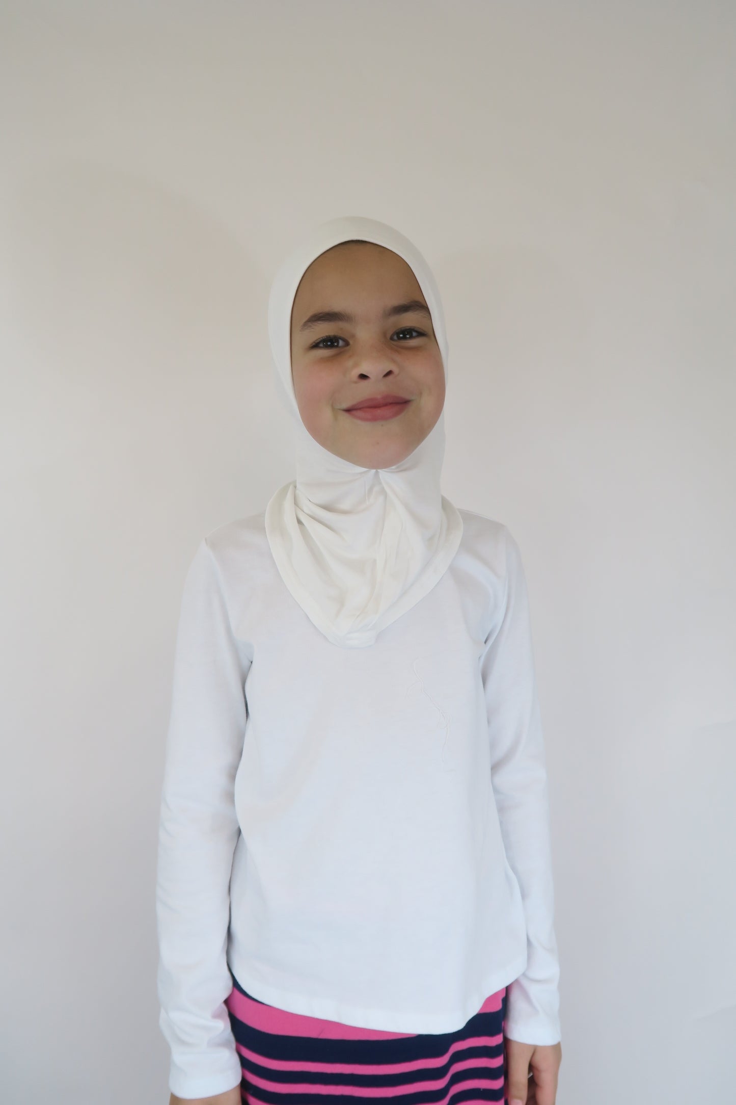 Girls wearing white jersey undercap ninja style