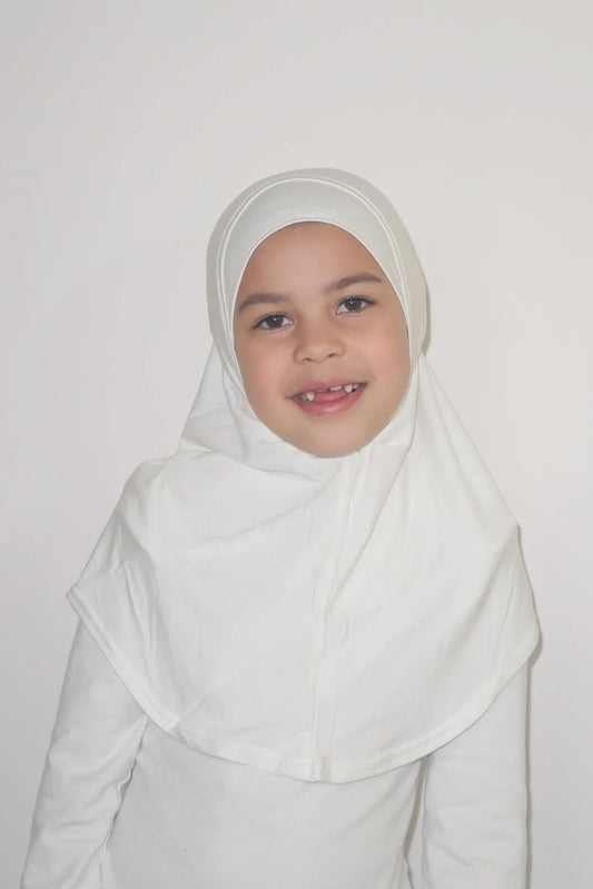 young girls wearing a white hijab against a plain background