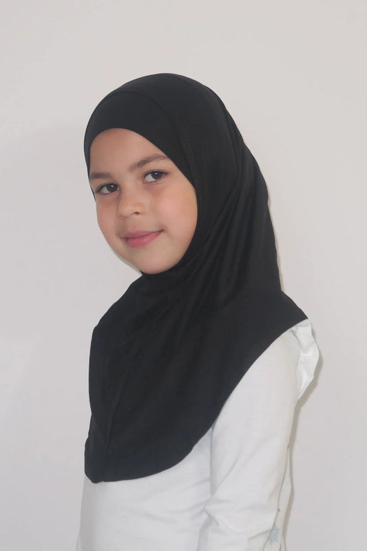 Person wearing a black hijab and white shirt on a plain background
